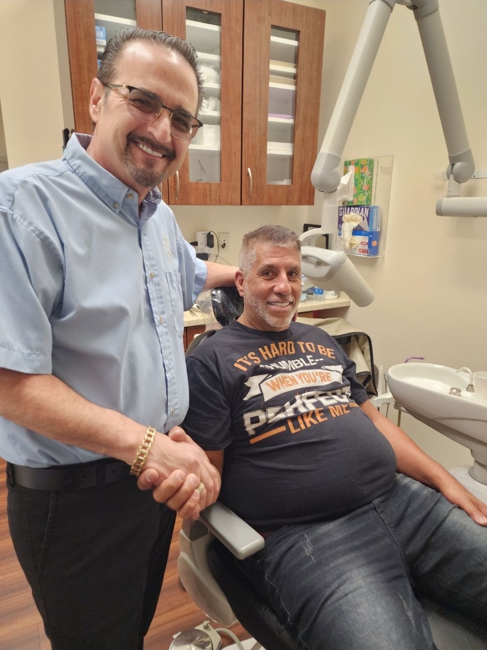 Dr. Spiros Karas with a patient at Classic Dental Arts in Manalapan, New Jersey.